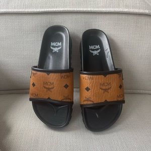 MCM Leather Slides
Printed
Rubber Trim
Wedge Heels